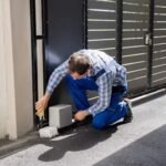 a person is troubleshooting issues with sliding gate openers