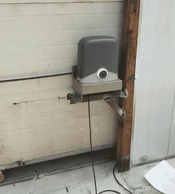 A gate opener installed at a certain distance from the ground